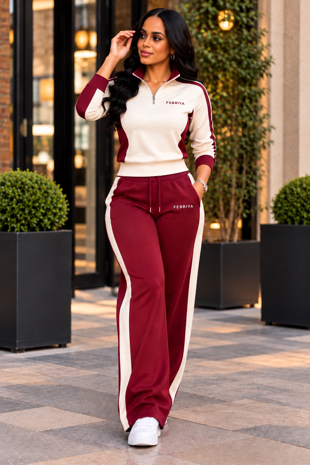 Woman wearing the Ivory × Ember quarter-zip and wide-leg tracksuit