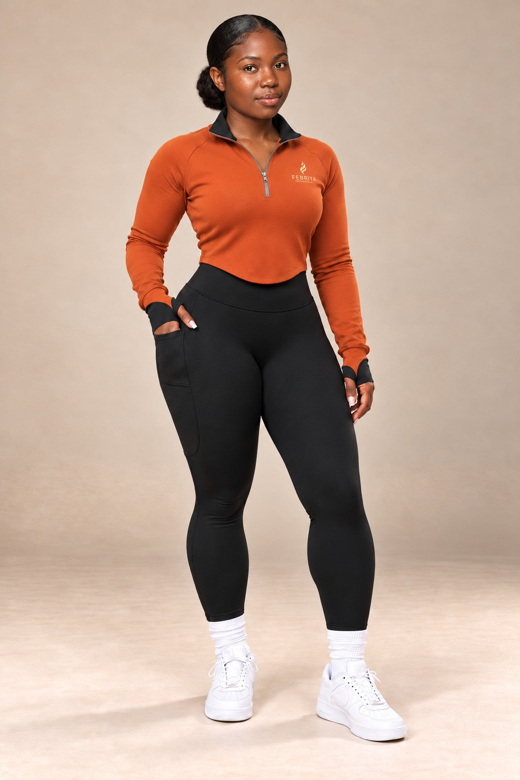Terracotta quarter-zip with black leggings